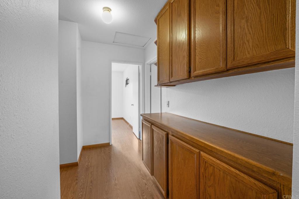 10254 Princess Joann Road Santee, CA 92071 - Photo 19 of 41 a view of storage and utility room with wooden floor