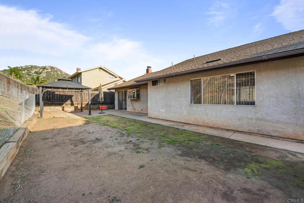10254 Princess Joann Road Santee, CA 92071 - Photo 28 of 41 a view of a house with a yard