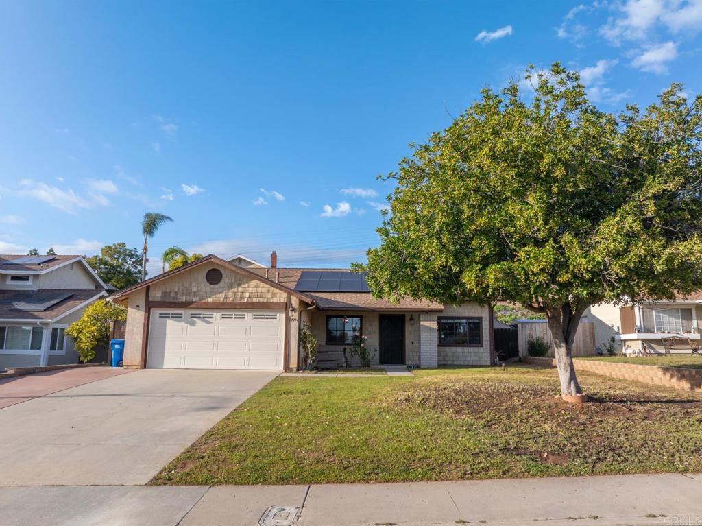 10254 Princess Joann Road Santee, CA 92071 - Photo 32 of 41 a front view of a house with a yard and a garage