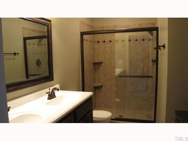 4134 Trotter Ridge Road Durham, NC 27707 - Photo 8 of 10 Gorgeous master bath has tiled walk-in shower and built in vanity/cabinet. Master Bath/Spa
