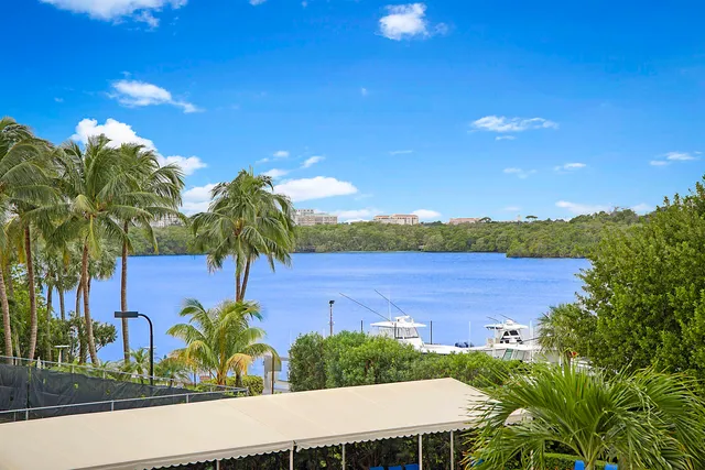 a living room with furniture tv and a large window