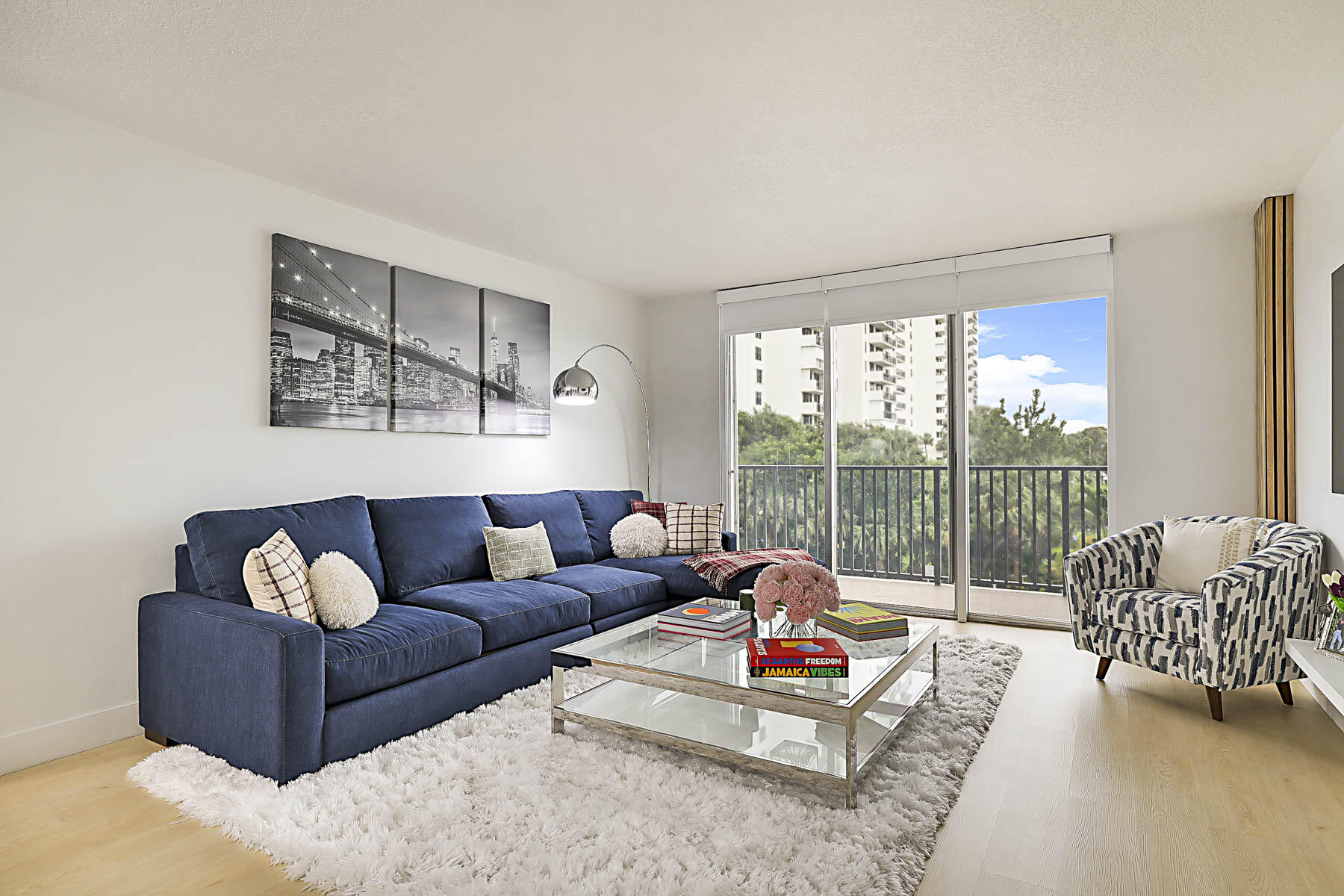 2121 North Ocean Boulevard, Unit 305W Boca Raton, FL 33431 - Photo 6 of 75 a living room with furniture and a large window