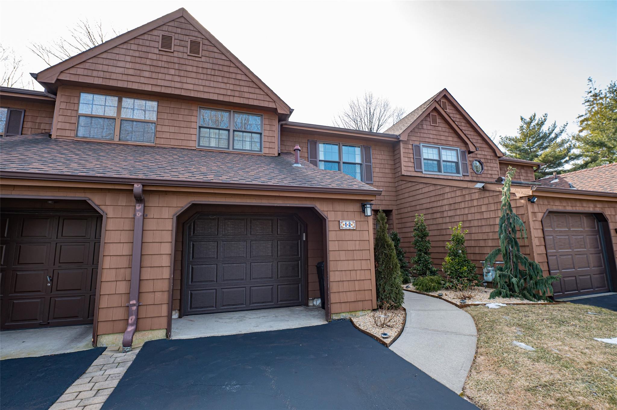 a front view of a house with a garage