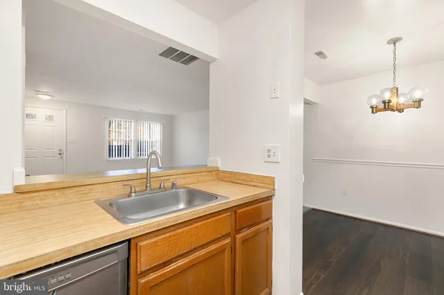 a kitchen with a sink and a refrigerator