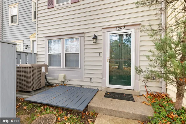 a view of a house with a door and wooden floor