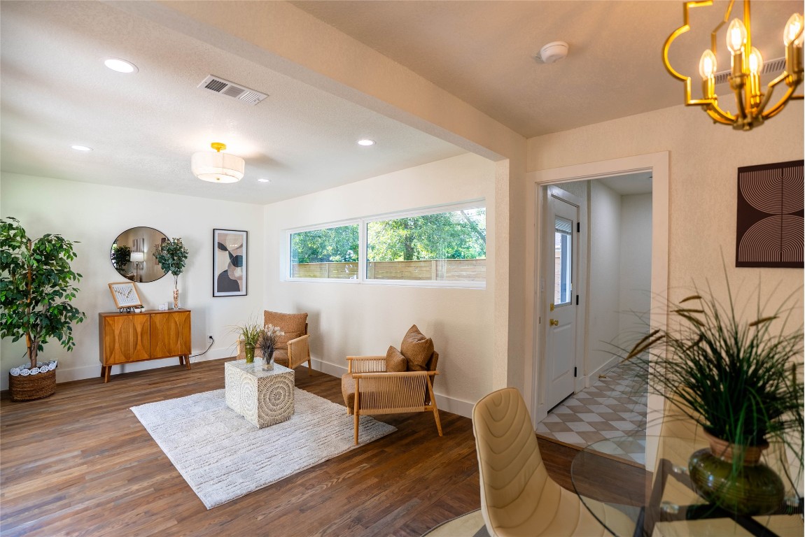 7700 Robalo Road Austin, TX 78757 - Photo 12 of 23 a living room with furniture and a large window