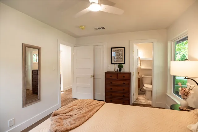 a bedroom with a bed and a dresser