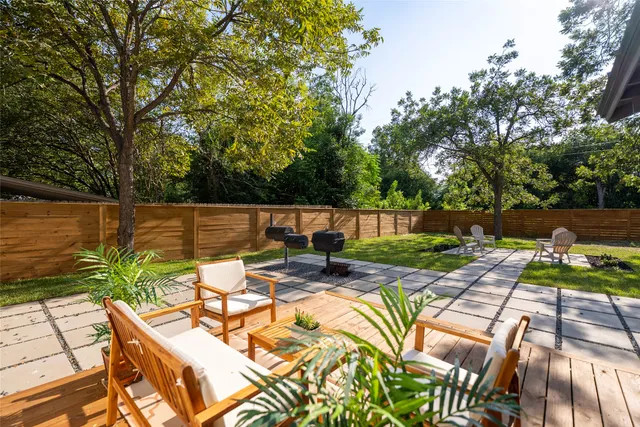 a view of swimming pool with outdoor seating