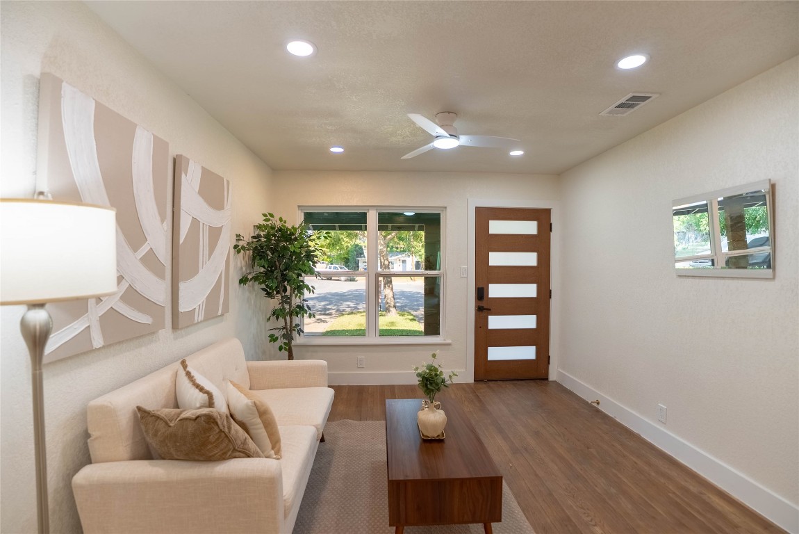 7700 Robalo Road Austin, TX 78757 - Photo 7 of 23 a living room with furniture and a window