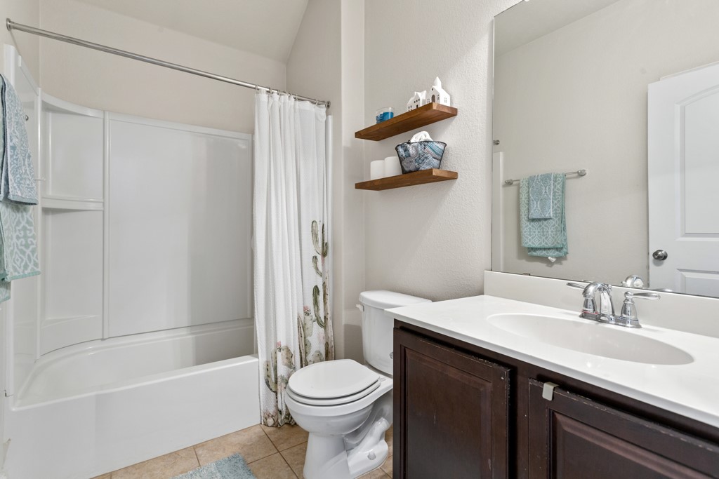 1916 Elaina Loop Leander, TX 78641 - Photo 17 of 23 a bathroom with a sink a toilet and shower