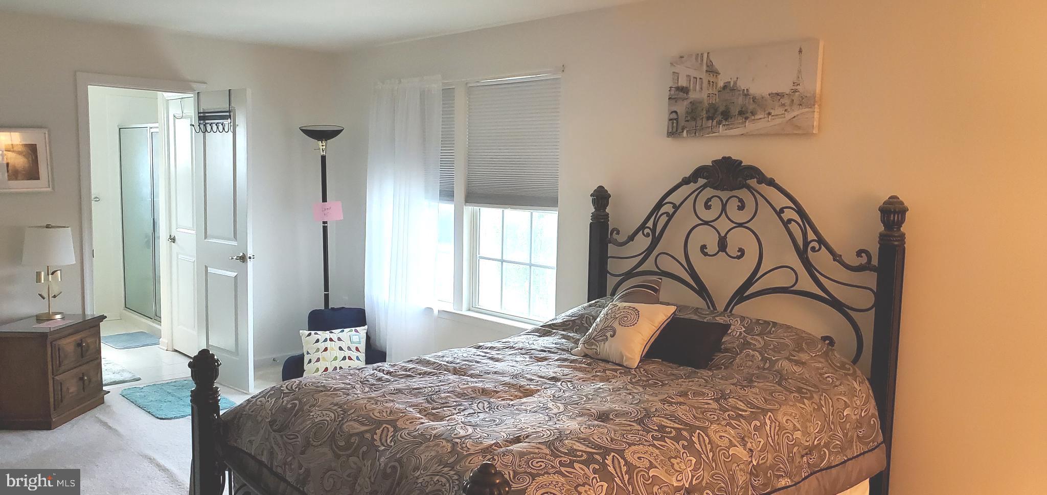 1999 Crossings Way Quakertown, PA 18951 - Photo 15 of 30 a bedroom with a bed and a table in it