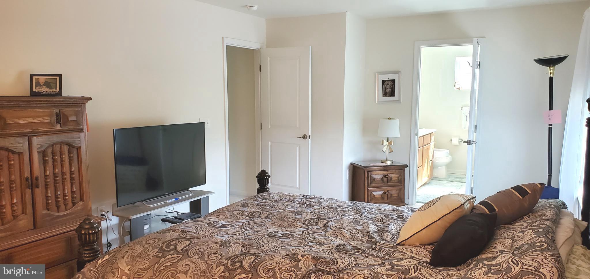 1999 Crossings Way Quakertown, PA 18951 - Photo 16 of 30 a bedroom with a bed and a flat screen tv