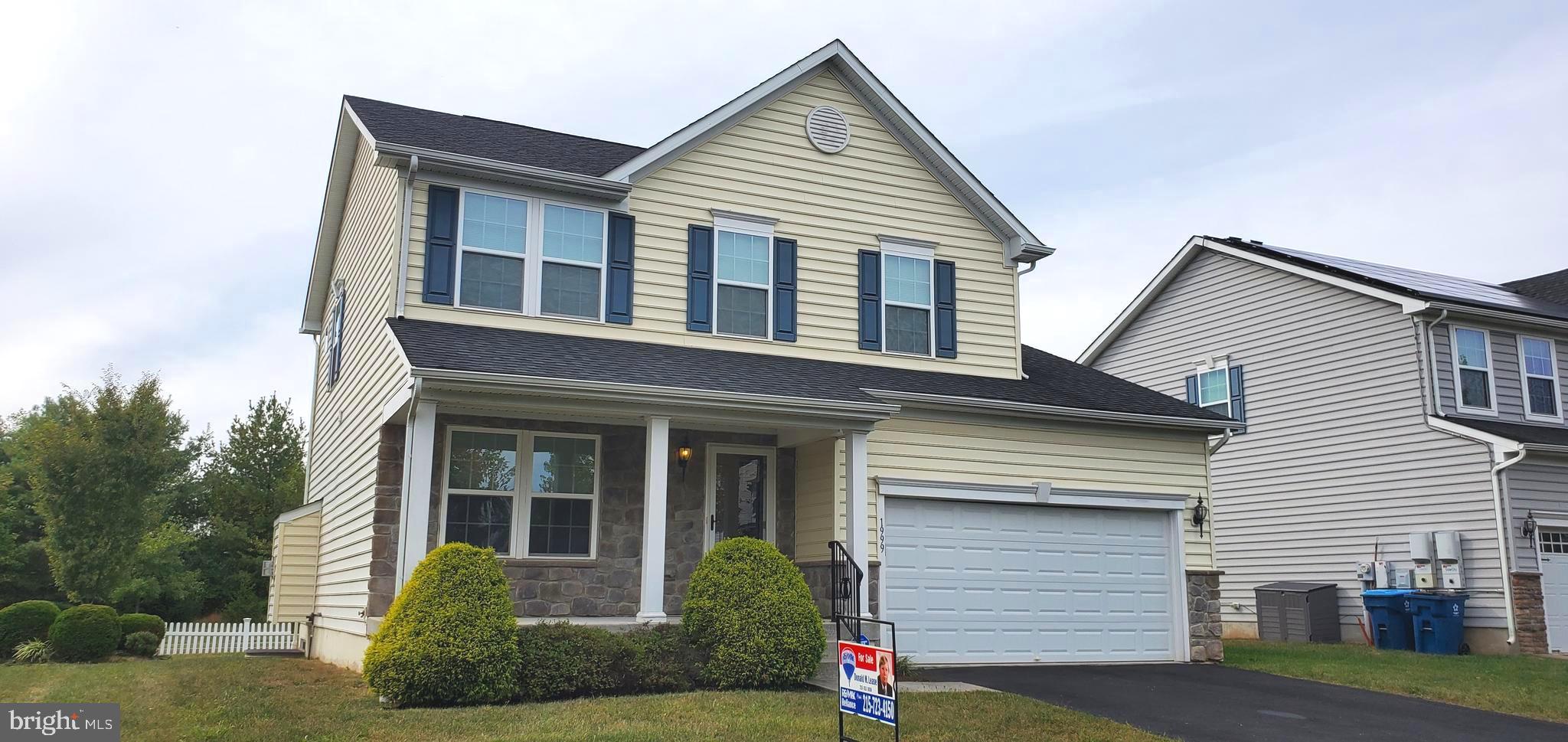 1999 Crossings Way Quakertown, PA 18951 - Photo 2 of 30 a front view of a house with yard