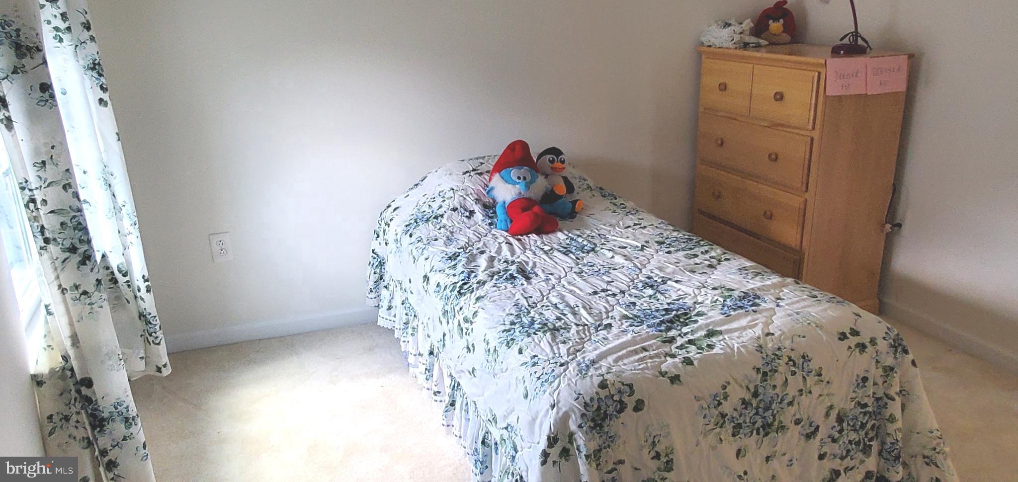 1999 Crossings Way Quakertown, PA 18951 - Photo 21 of 30 a bed sitting in a bedroom next to a window