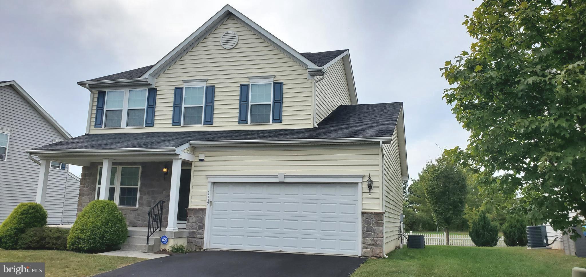1999 Crossings Way Quakertown, PA 18951 - Photo 29 of 30 a front view of a house with a garden