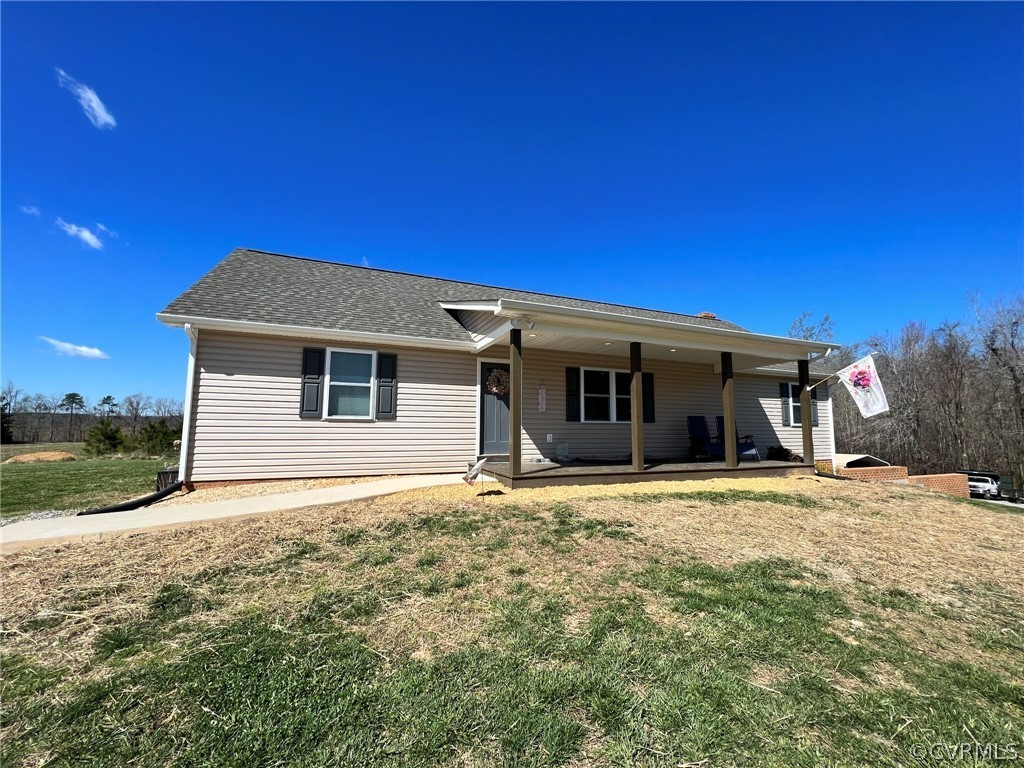 1214 Wilson Road Wilsons, VA 23894 - Photo 1 of 41 a front view of a house with garden