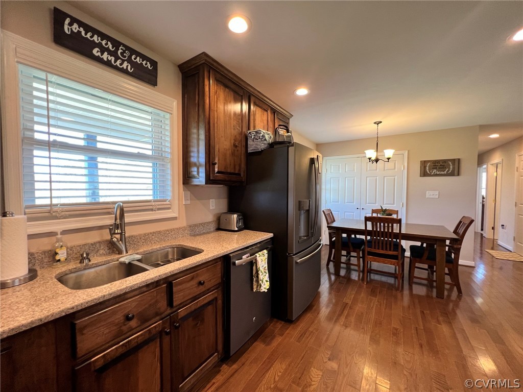 1214 Wilson Road Wilsons, VA 23894 - Photo 11 of 41 a kitchen with kitchen island granite countertop a sink a counter space stainless steel appliances and dining table