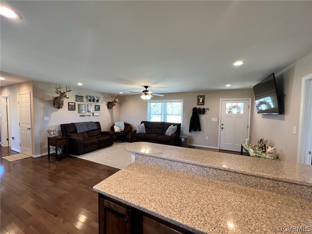1214 Wilson Road Wilsons, VA 23894 - Photo 12 of 41 a living room with furniture and wooden floor