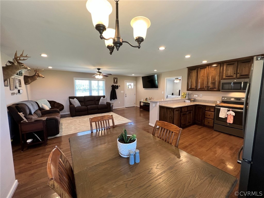 1214 Wilson Road Wilsons, VA 23894 - Photo 13 of 41 a large kitchen with a large counter top appliances and cabinets