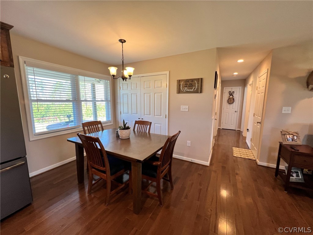 1214 Wilson Road Wilsons, VA 23894 - Photo 14 of 41 a view of a dining room with furniture window and wooden floor