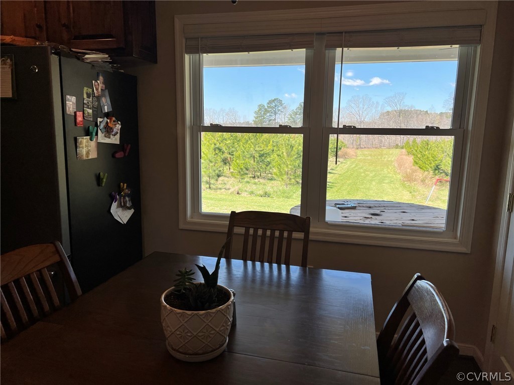 1214 Wilson Road Wilsons, VA 23894 - Photo 15 of 41 a living room with furniture and a large window