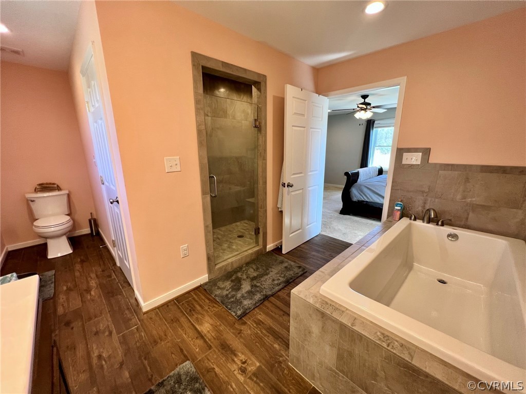1214 Wilson Road Wilsons, VA 23894 - Photo 20 of 41 a bathroom with a sink a toilet and shower