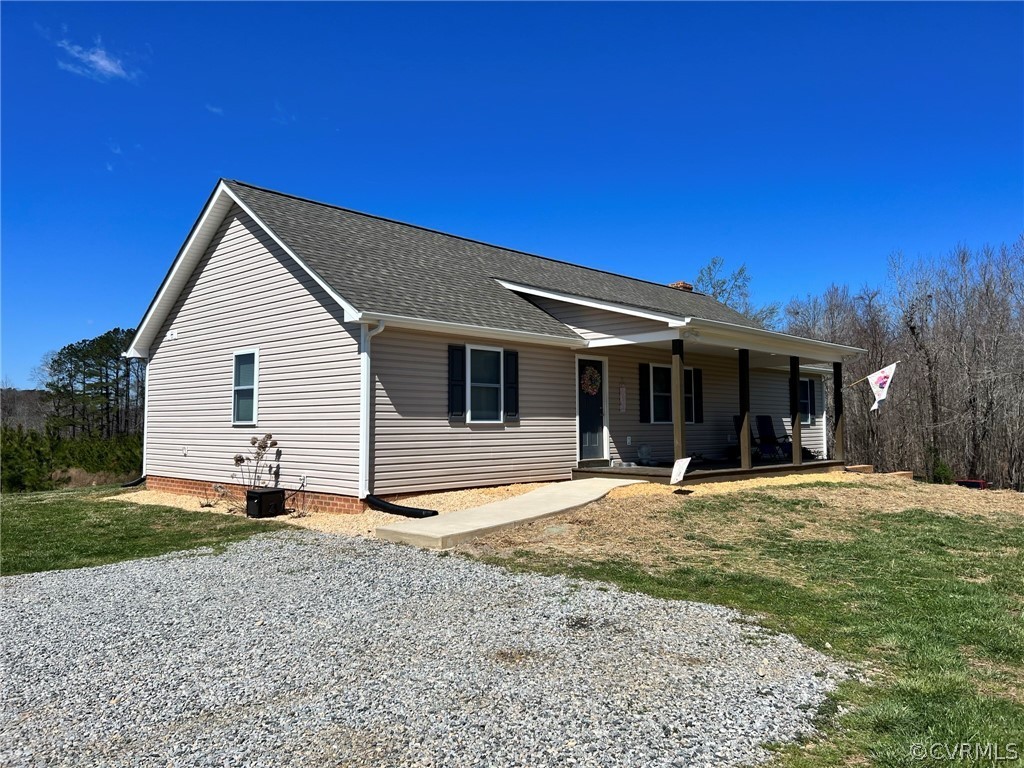 1214 Wilson Road Wilsons, VA 23894 - Photo 2 of 41 a front view of a house with a yard