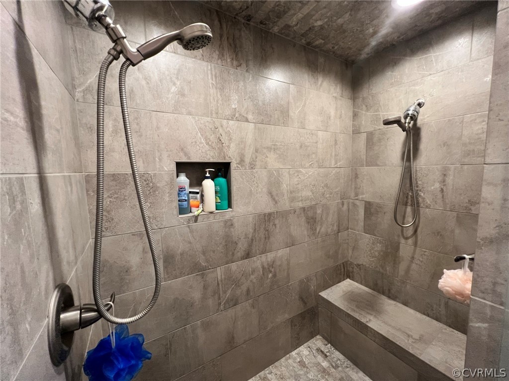 1214 Wilson Road Wilsons, VA 23894 - Photo 21 of 41 a bathroom with a sink and shower