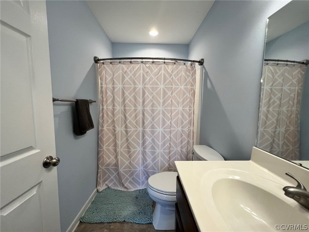1214 Wilson Road Wilsons, VA 23894 - Photo 26 of 41 a bathroom with a toilet and a shower