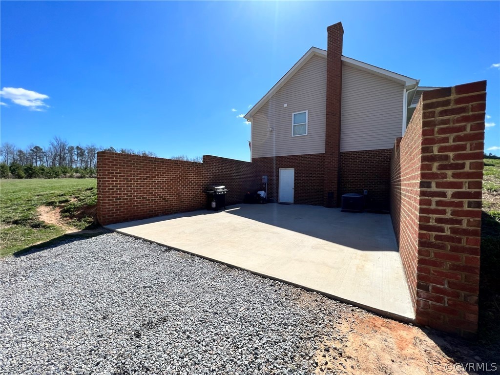 1214 Wilson Road Wilsons, VA 23894 - Photo 31 of 41 a front view of a house with a yard