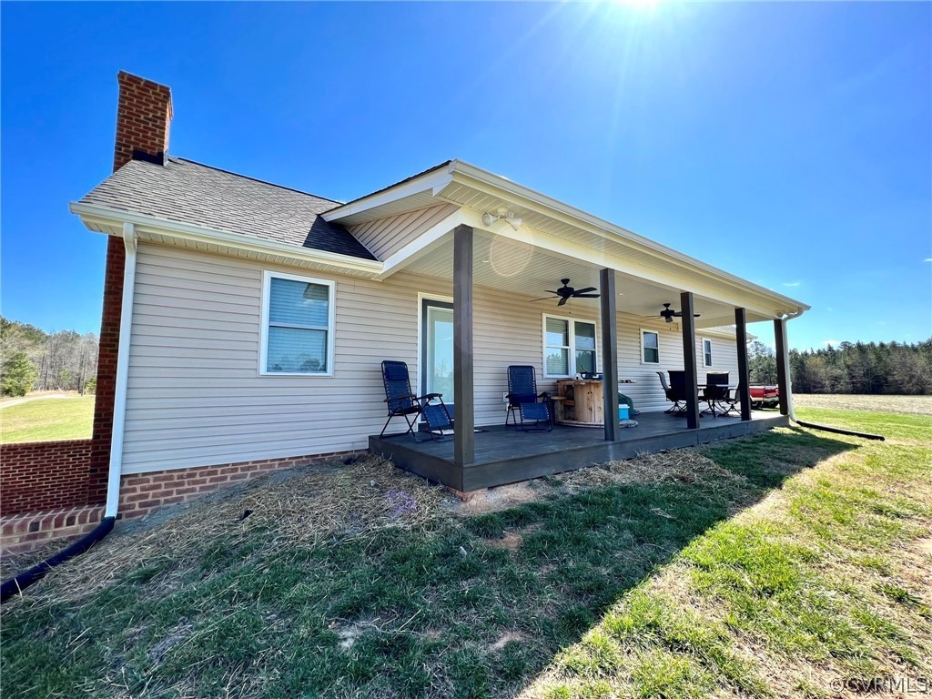 1214 Wilson Road Wilsons, VA 23894 - Photo 32 of 41 a view of a house with backyard porch and sitting area
