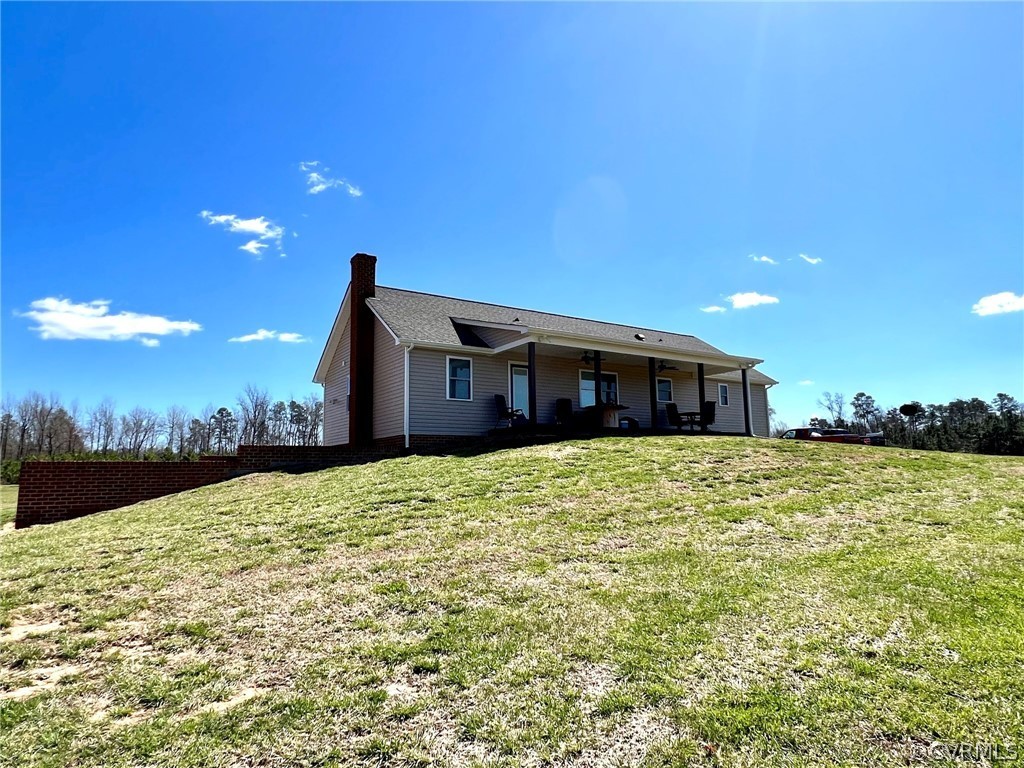 1214 Wilson Road Wilsons, VA 23894 - Photo 35 of 41 a view of a house with a yard