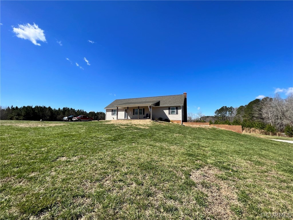 1214 Wilson Road Wilsons, VA 23894 - Photo 41 of 41 a front view of a house with a yard
