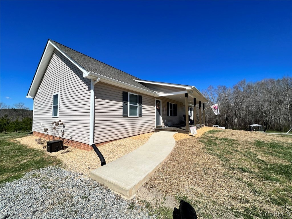 1214 Wilson Road Wilsons, VA 23894 - Photo 5 of 41 a view of a house with a patio