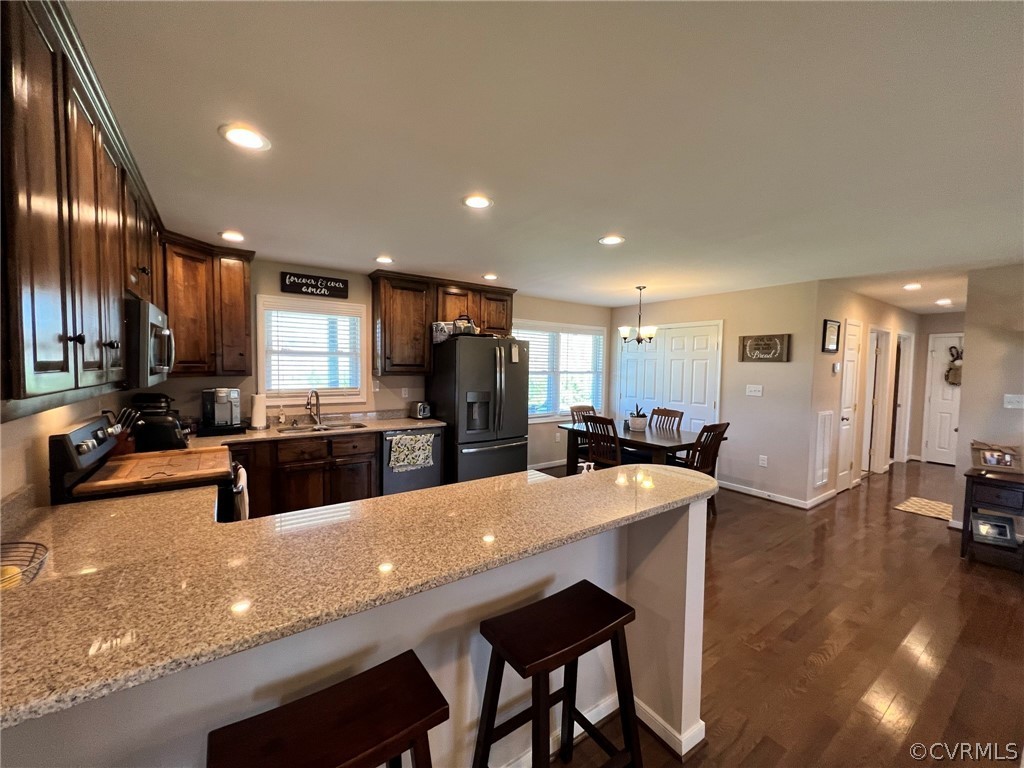 1214 Wilson Road Wilsons, VA 23894 - Photo 8 of 41 a large kitchen with stainless steel appliances lots of counter space and breakfast area