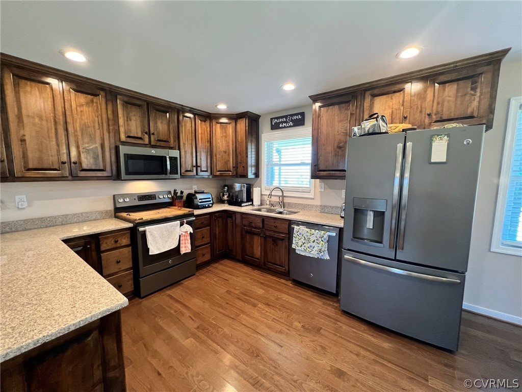 1214 Wilson Road Wilsons, VA 23894 - Photo 10 of 41 a kitchen with stainless steel appliances granite countertop a refrigerator stove top oven a sink and dishwasher