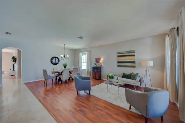 a living room with furniture and a window