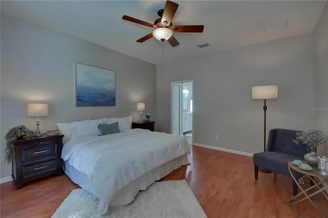 a bathroom with a double vanity sink mirror and shower