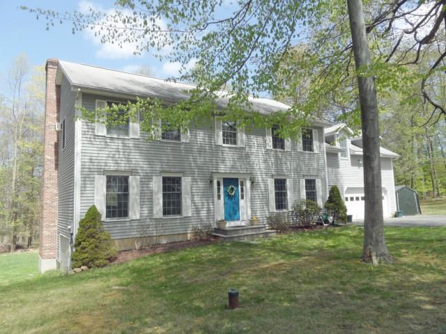 38 Horseshoe Ridge Road Newtown, CT 06482 - Photo 1 of 1 a front view of a house with a yard