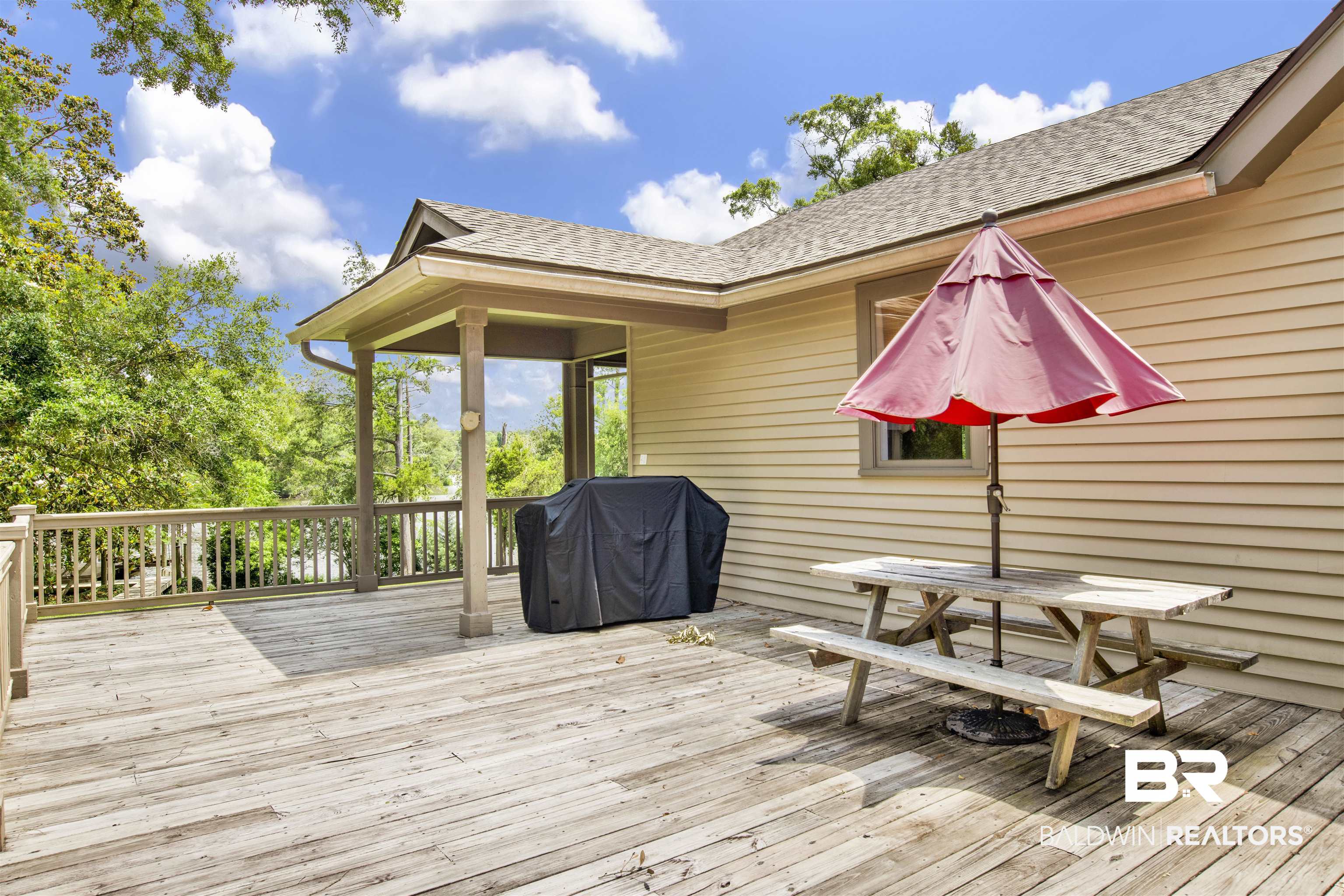 16864 Ferry Rd Circle Fairhope, AL 36532 - Photo 6 of 68 Wooden deck with grilling area and outdoor dining space