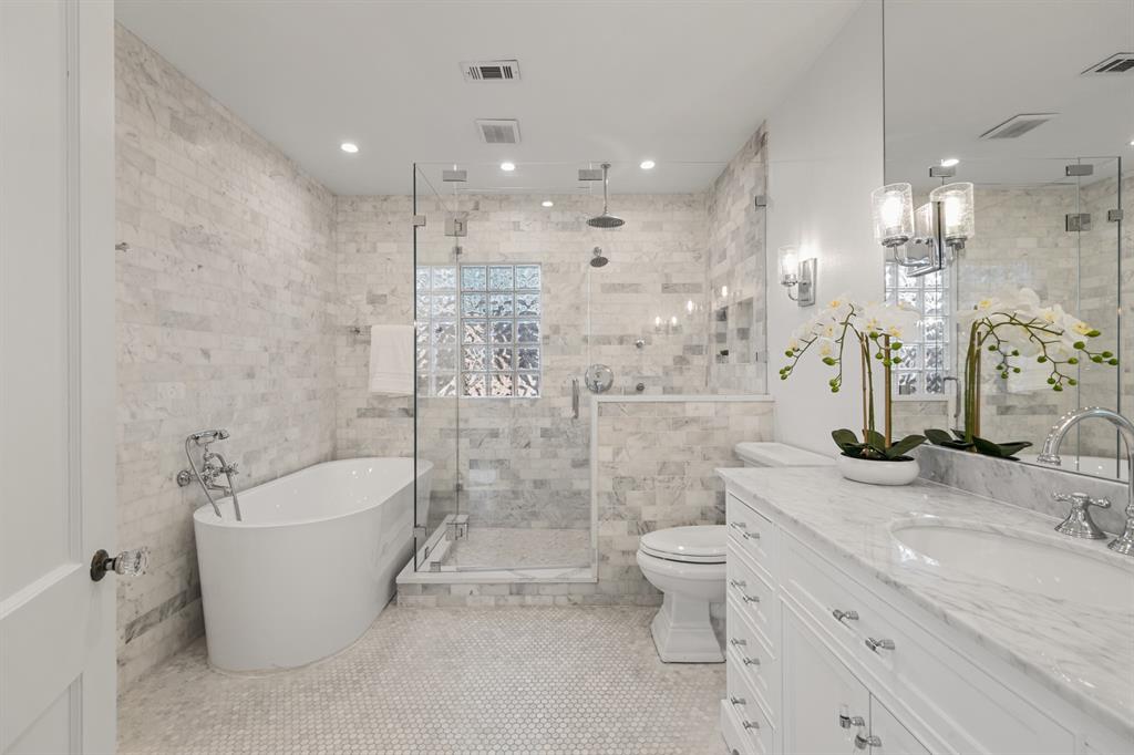 5242 Merrimac Avenue Dallas, TX 75206 - Photo 16 of 25 Bathroom featuring vanity, a stall shower, a soaking tub, tile walls, and light tile patterned flooring