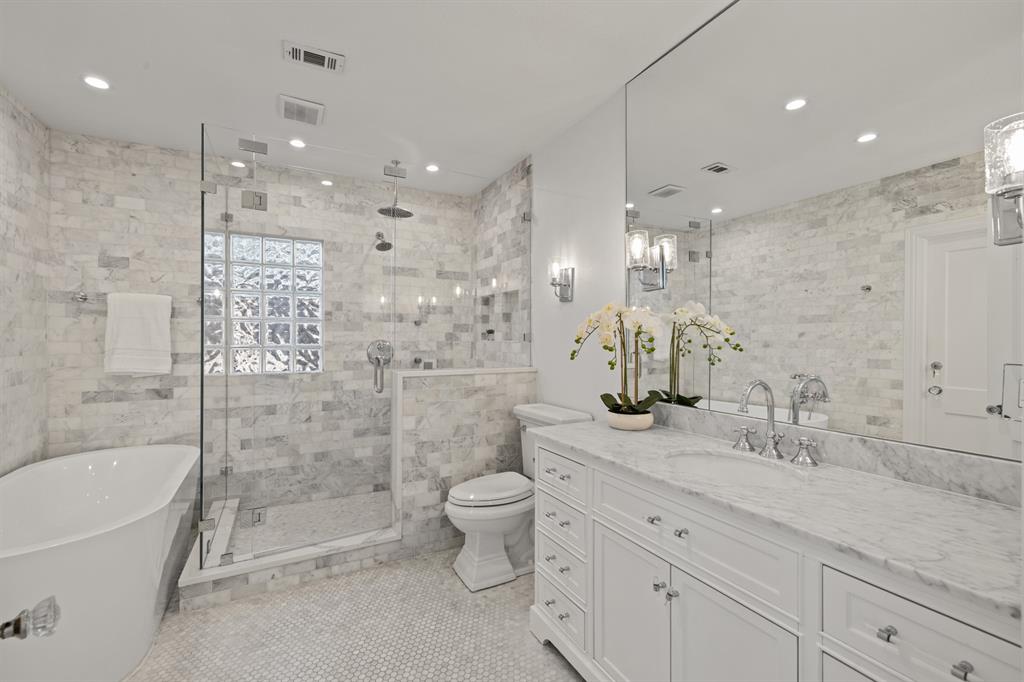 5242 Merrimac Avenue Dallas, TX 75206 - Photo 17 of 25 Full bath with a shower stall, vanity, a freestanding tub, tile walls, and light tile patterned floors