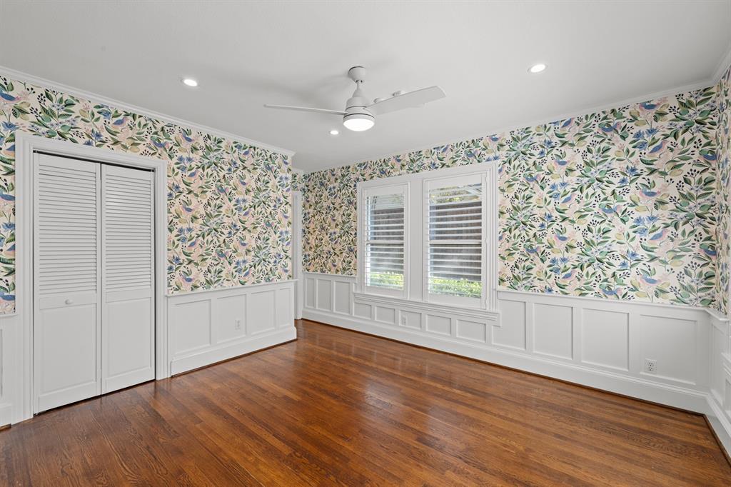 5242 Merrimac Avenue Dallas, TX 75206 - Photo 19 of 25 Unfurnished bedroom with wallpapered walls, crown molding, a closet, recessed lighting, and dark wood-style flooring