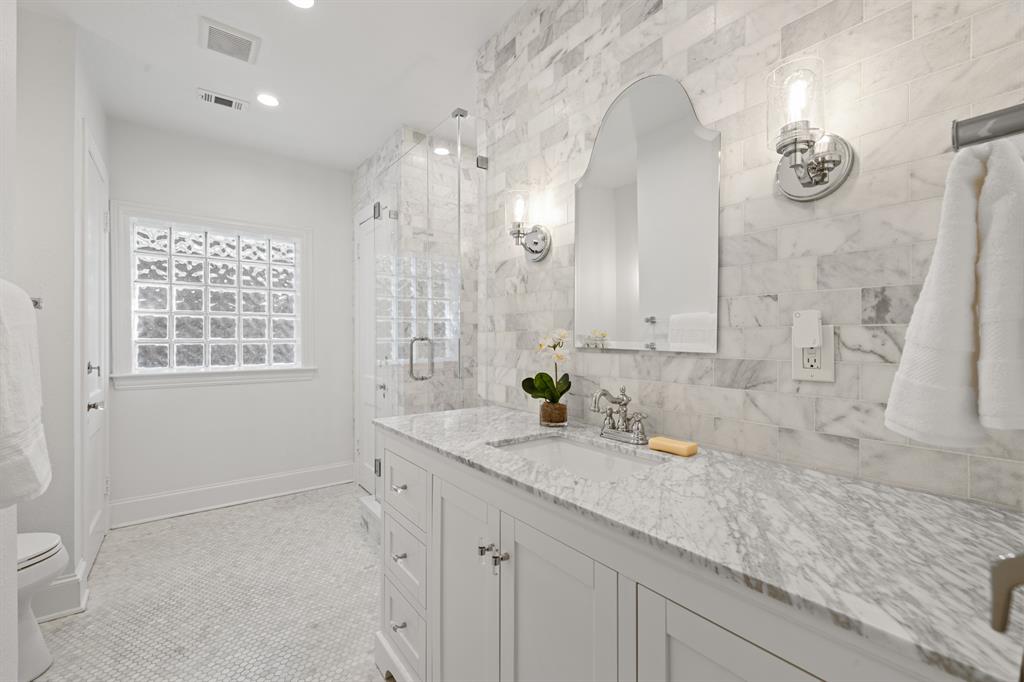 5242 Merrimac Avenue Dallas, TX 75206 - Photo 20 of 25 Full bathroom with a stall shower, vanity, tasteful backsplash, recessed lighting, and light tile patterned floors