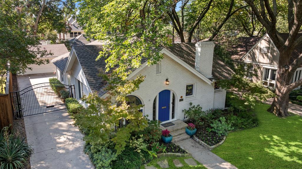 5242 Merrimac Avenue Dallas, TX 75206 - Photo 25 of 25 View of front of house with a gate, brick siding, a chimney, a shingled roof, and a front yard