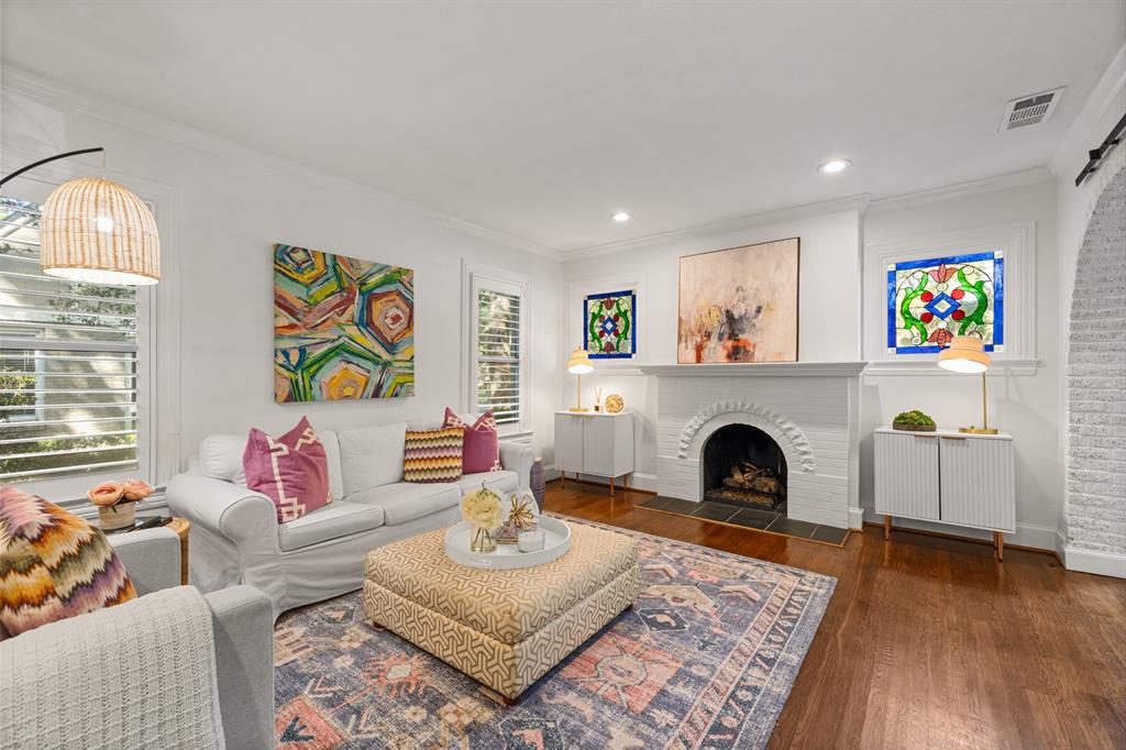 5242 Merrimac Avenue Dallas, TX 75206 - Photo 6 of 25 Living room featuring ornamental molding, radiator, dark wood-style floors, a fireplace, and recessed lighting