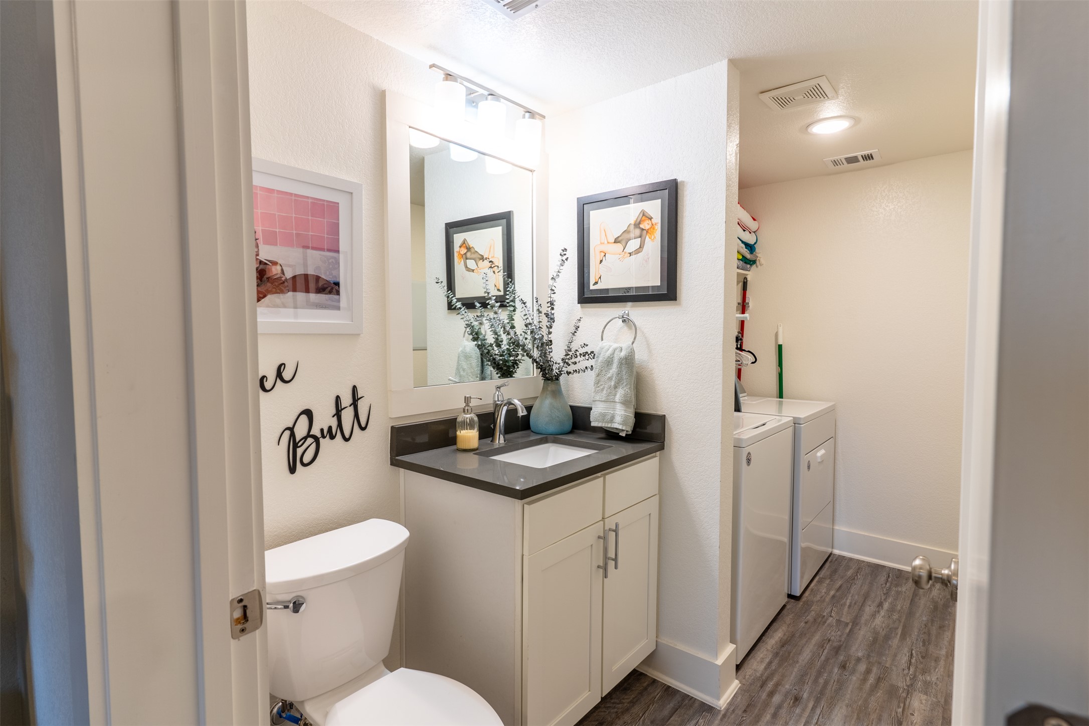 2827 Manor Road, Unit 2202 Austin, TX 78722 - Photo 16 of 20 Functional full bathroom and laundry area with clean lines.