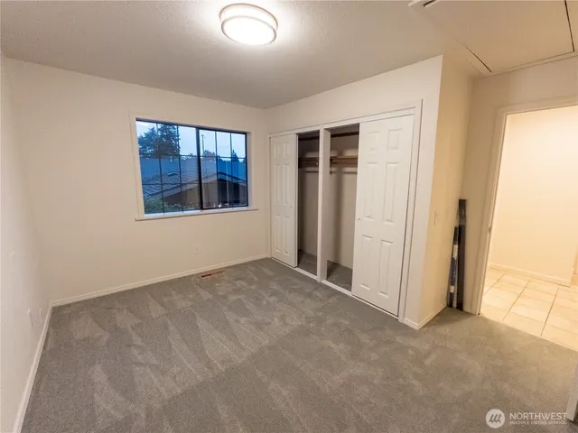 a bathroom with a double vanity sink mirror and bathtub