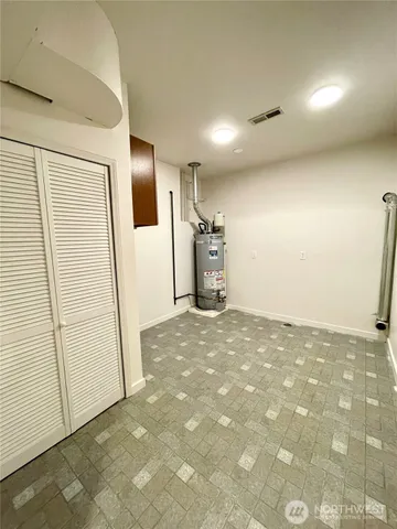 a view of a room with a sink and wooden floor