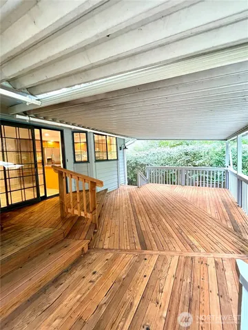 a view of a house with swimming pool and a yard
